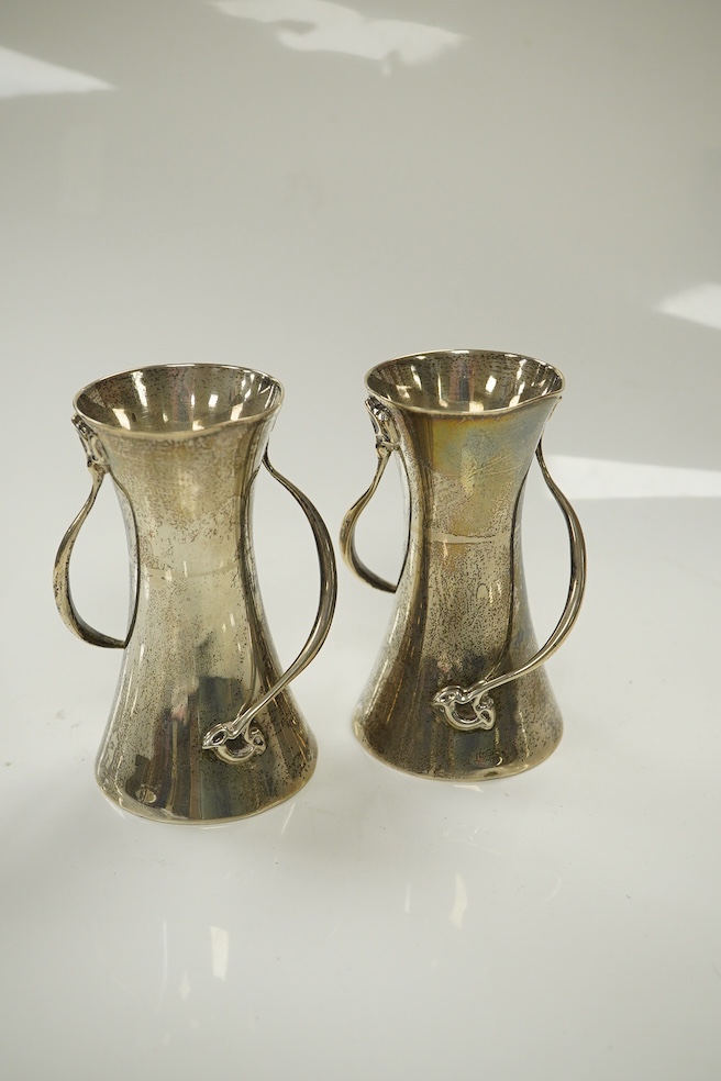 A pair of Edwardian Art Nouveau silver small vases, Walker & Hall, Sheffield, 1906, 10.1cm, 7.4oz. Condition - fair